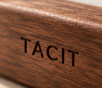 TACIT engraved on the walnut stand